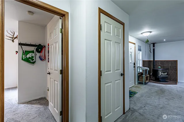 a view of a hallway with a livingroom and a livingroom