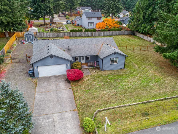 an aerial view of a house with a swimming pool
