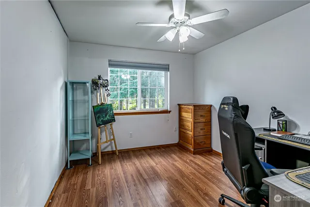 a workspace with furniture and wooden floor