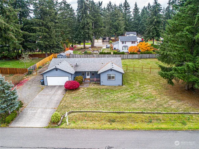 an aerial view of a house with outdoor space