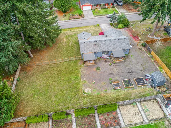 an aerial view of a house with a swimming pool