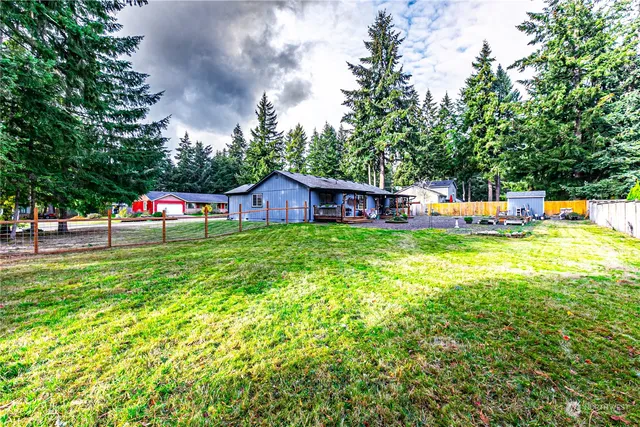 a view of a house with a yard porch and sitting area