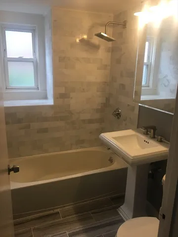 a bathroom with a sink and a bathtub