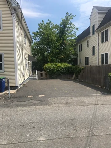 a view of a house with a yard and garage