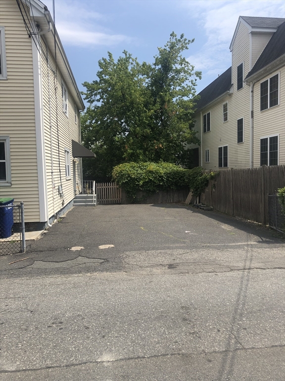 18 Murdock Street, Unit 1 Somerville, MA 02145 - Photo 10 of 10 a view of a house with a yard and garage