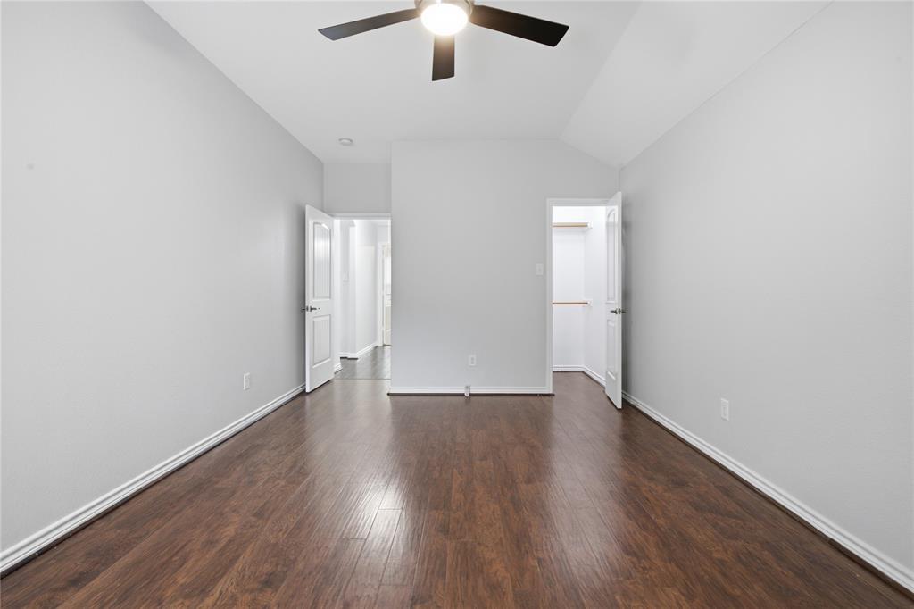 10001 Thurman Road Fort Worth, TX 76244 - Photo 23 of 40 Spacious room featuring wood-finish flooring and light gray walls