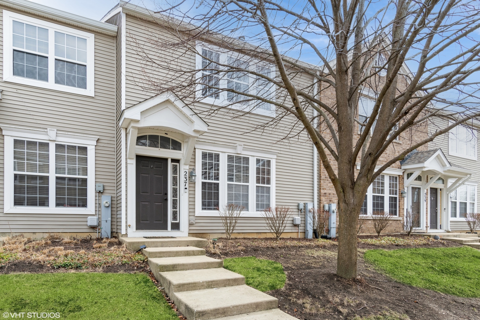 a front view of a house with a yard