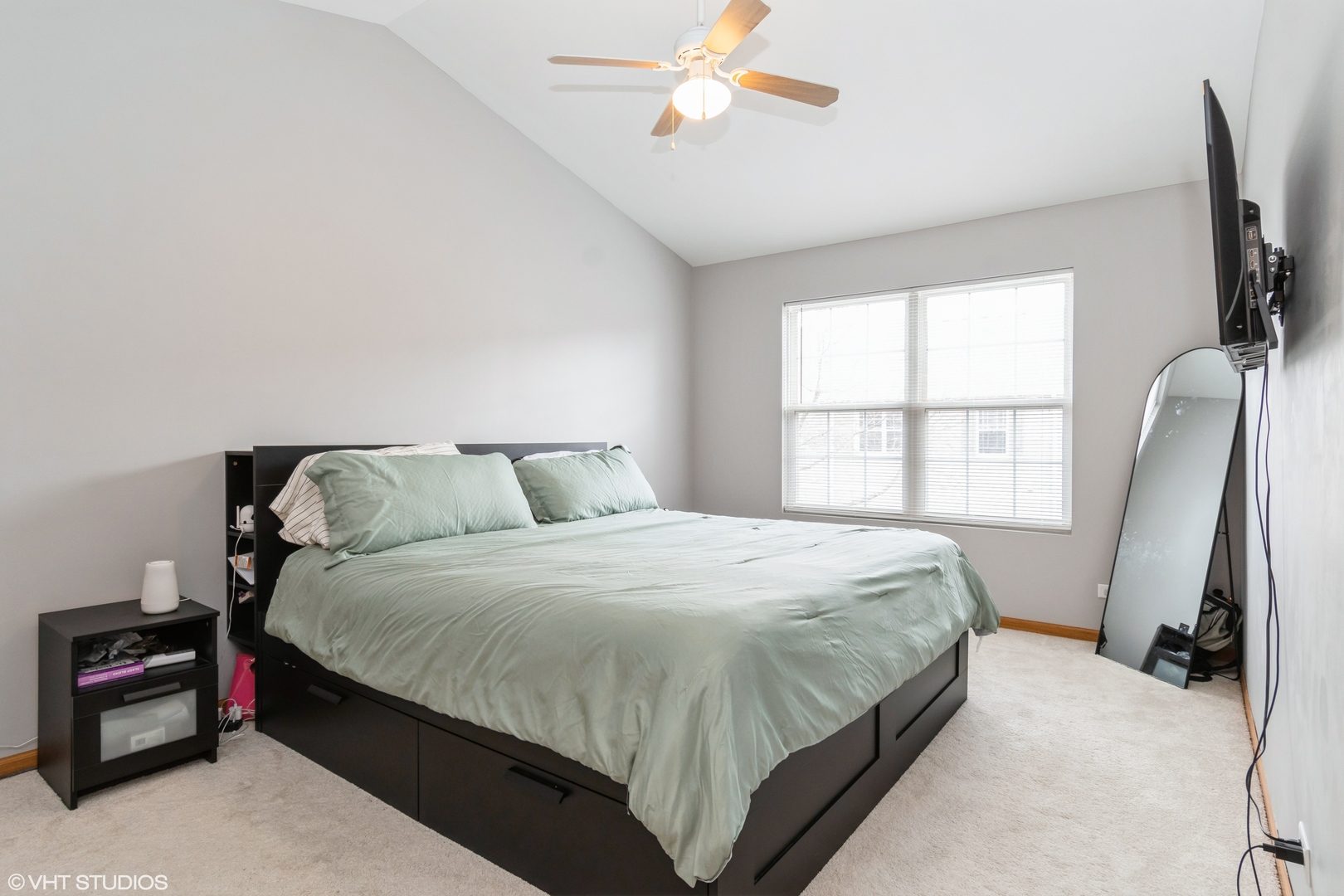 237 Springbrook Trail South, Unit 3 Oswego, IL 60543 - Photo 11 of 17 a bedroom with a bed a flat screen tv and a window