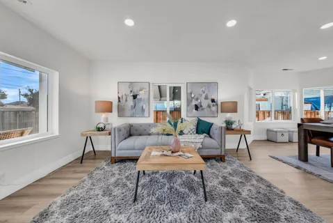 a view of a dining room with furniture window and outside view