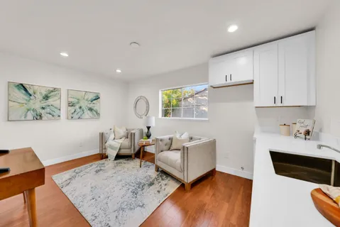 a front view of a house with table and chairs