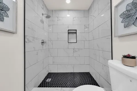 an aerial view of residential building and ocean view