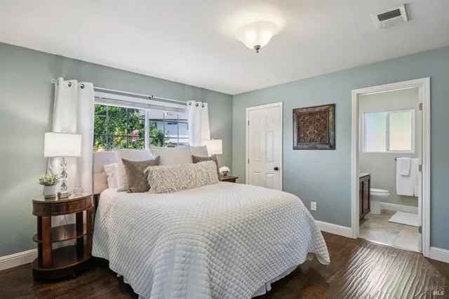 a bedroom with a bed and a dresser