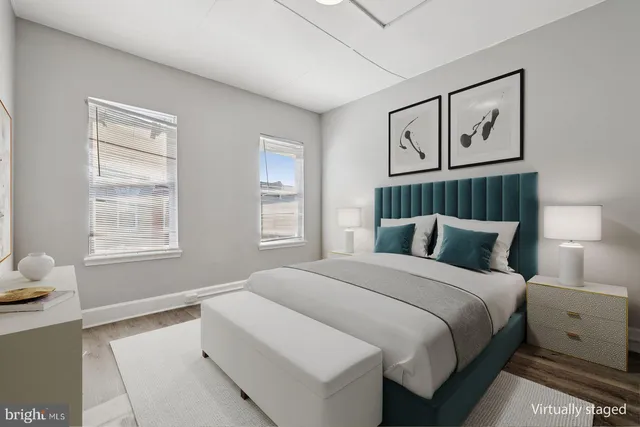 a bedroom with a large bed and a window