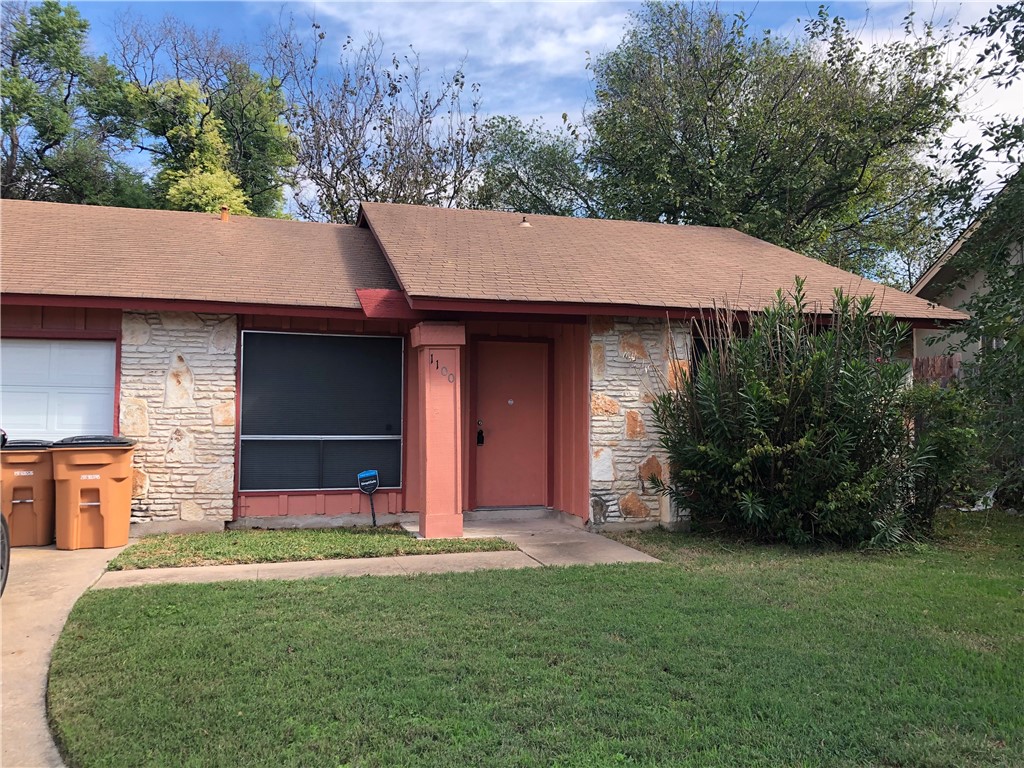 1100 Crown Ridge Path Austin, TX 78753 - Photo 1 of 1 a front view of a house with a garden