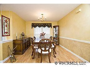 231 Farm Valley Road Fletcher, NC 28732 - Photo 3 of 12 a view of a dining room with furniture and wooden floor