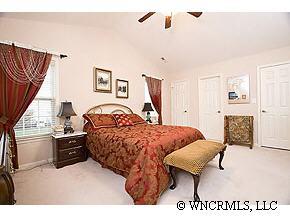 231 Farm Valley Road Fletcher, NC 28732 - Photo 6 of 12 a bed room with a bed and a television