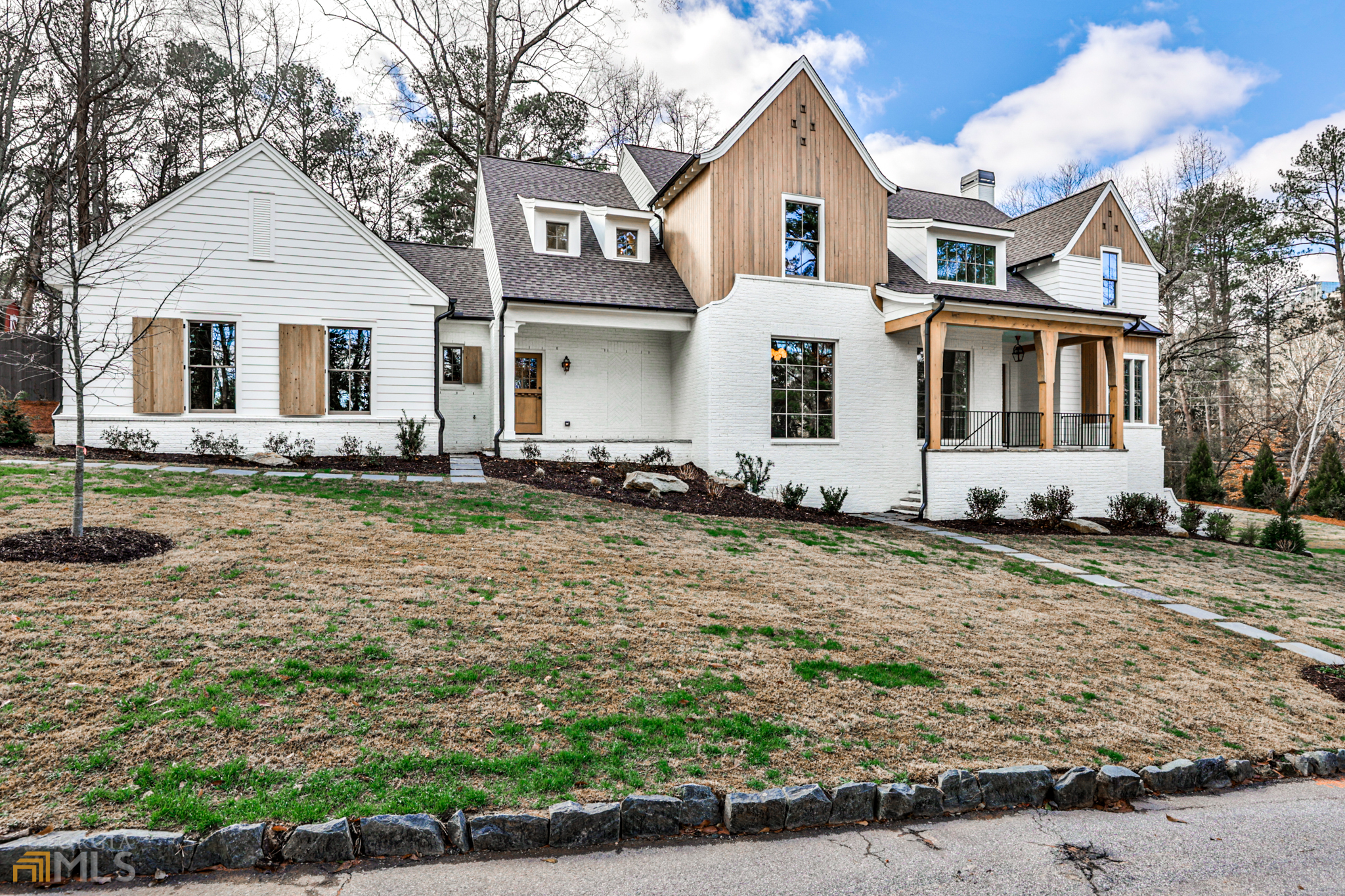 1155 Pine Ridge Road Northeast Atlanta, GA 30324 - Photo 1 of 1 a front view of a house with a yard