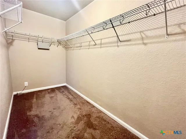 a view of a room with racks on the wall