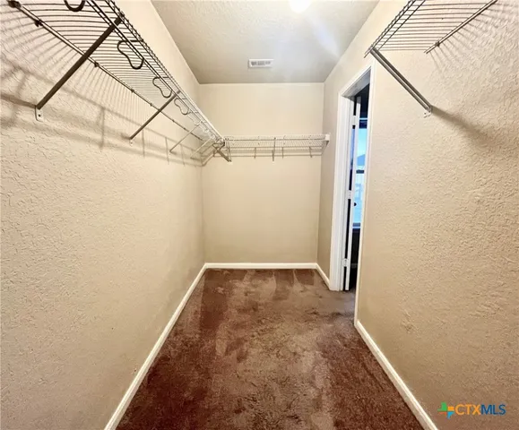 a view of a room with racks on the wall