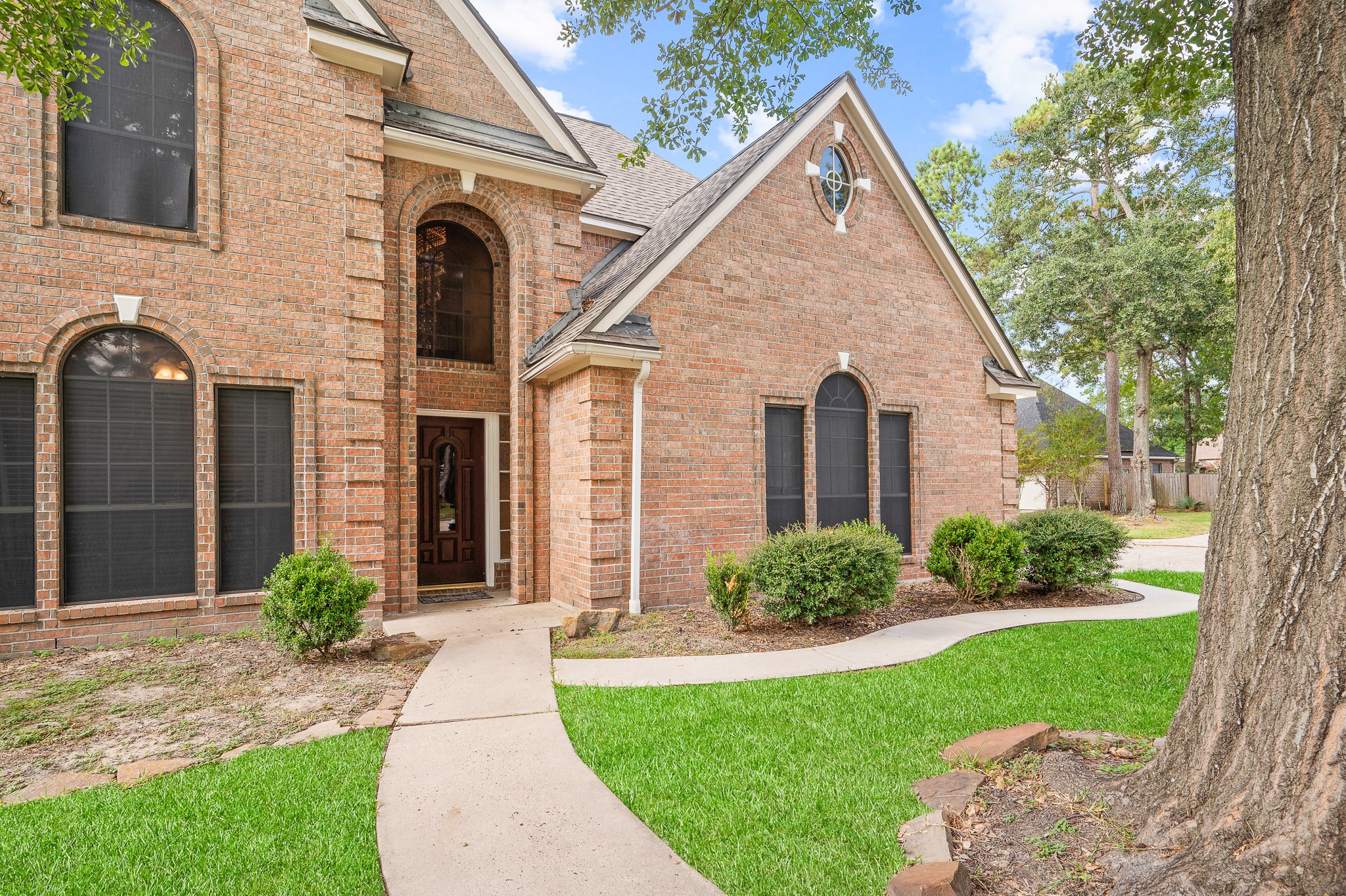 8111 Morningbrook Court Spring, TX 77379 - Photo 4 of 46 a front view of a house with garden