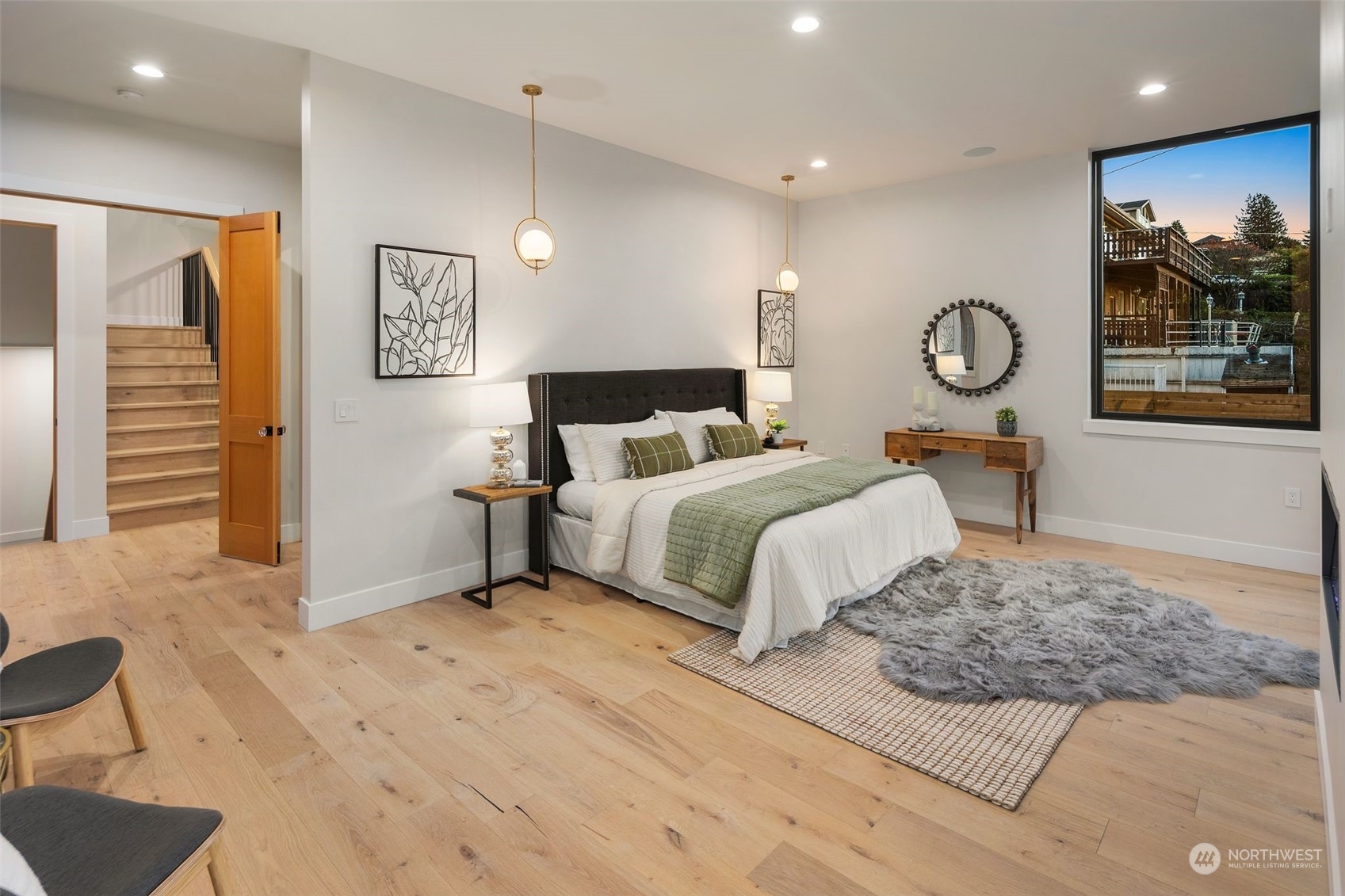6601 39th Avenue Southwest Seattle, WA 98136 - Photo 17 of 40 a bedroom with a large bed and a chandelier
