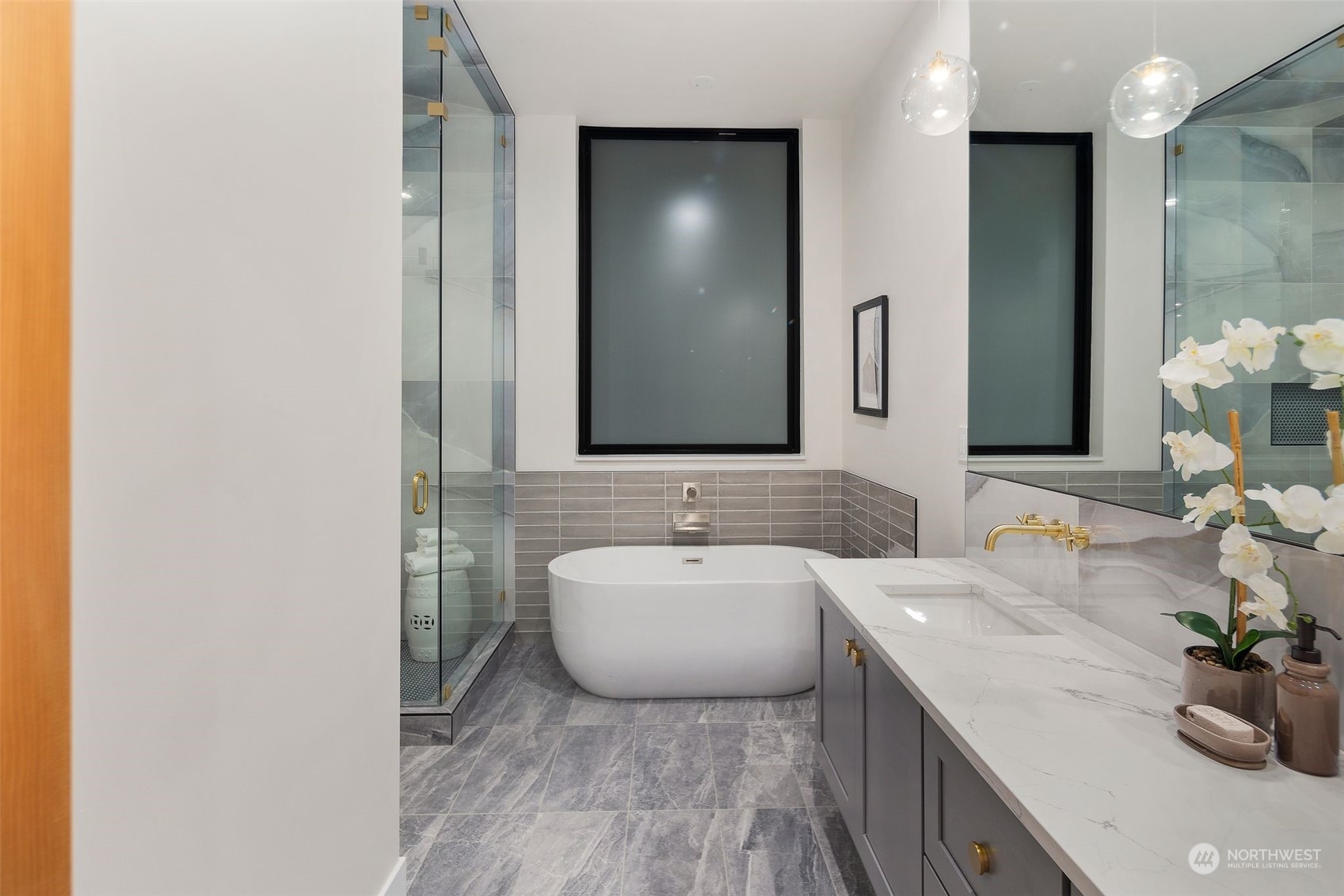 6601 39th Avenue Southwest Seattle, WA 98136 - Photo 22 of 40 a bathroom with a sink and a mirror