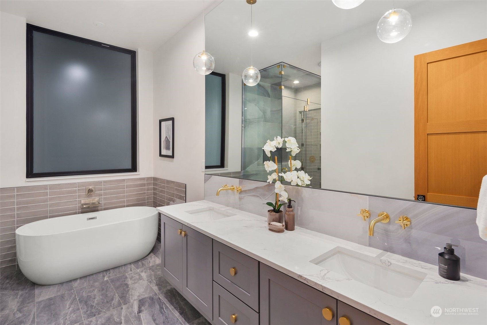 6601 39th Avenue Southwest Seattle, WA 98136 - Photo 23 of 40 a bathroom with a double vanity sink and a mirror