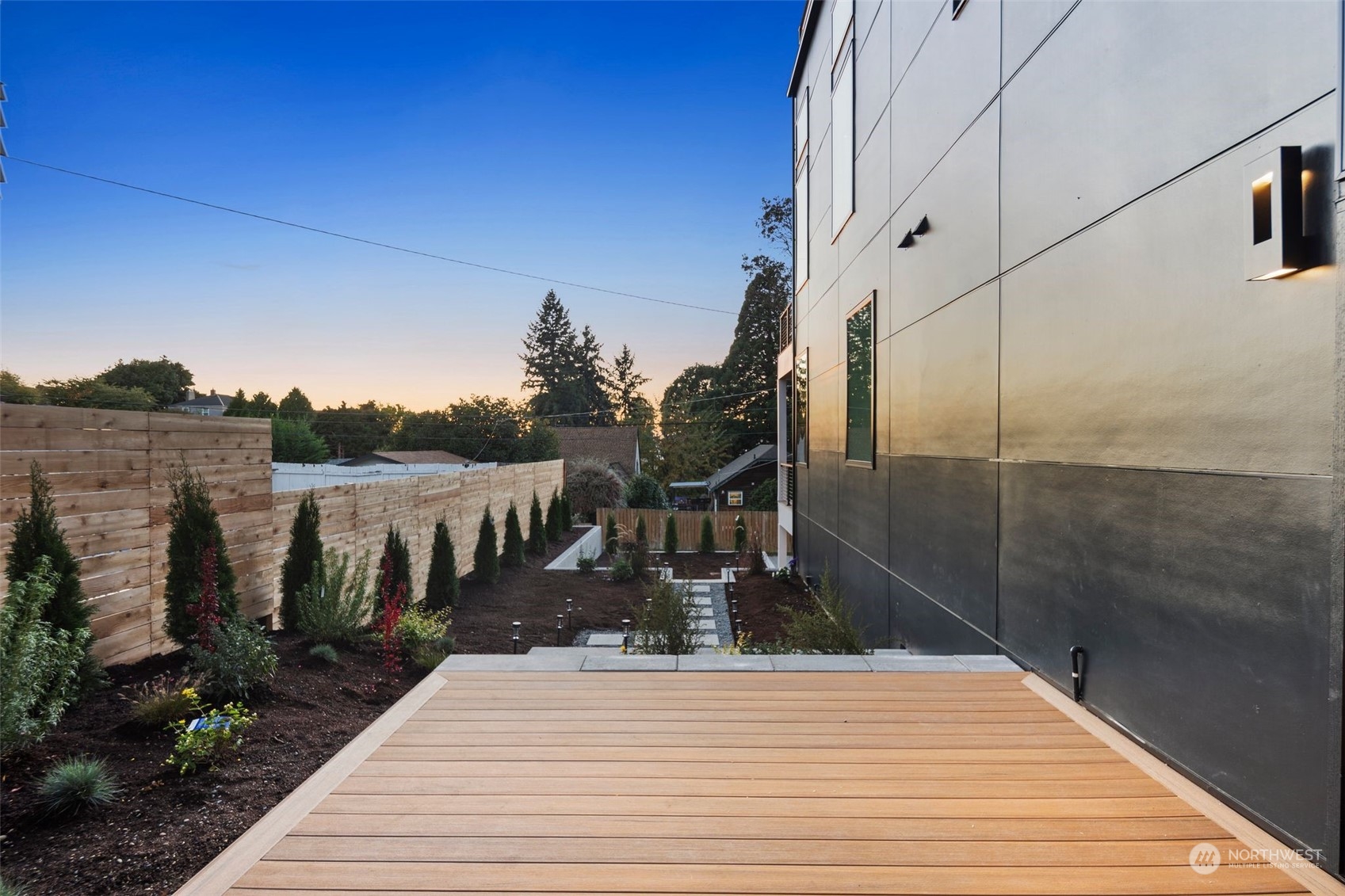 6601 39th Avenue Southwest Seattle, WA 98136 - Photo 32 of 40 a view of a balcony with floor to ceiling windows and wooden floor
