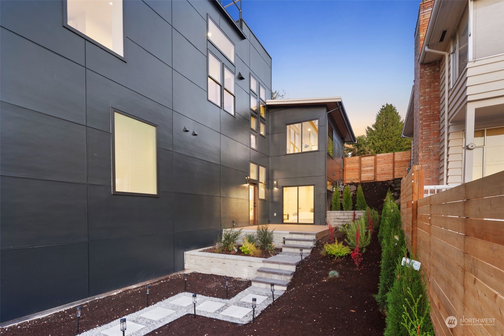 6601 39th Avenue Southwest Seattle, WA 98136 - Photo 33 of 40 a view of a patio with couches table and chairs and potted plants