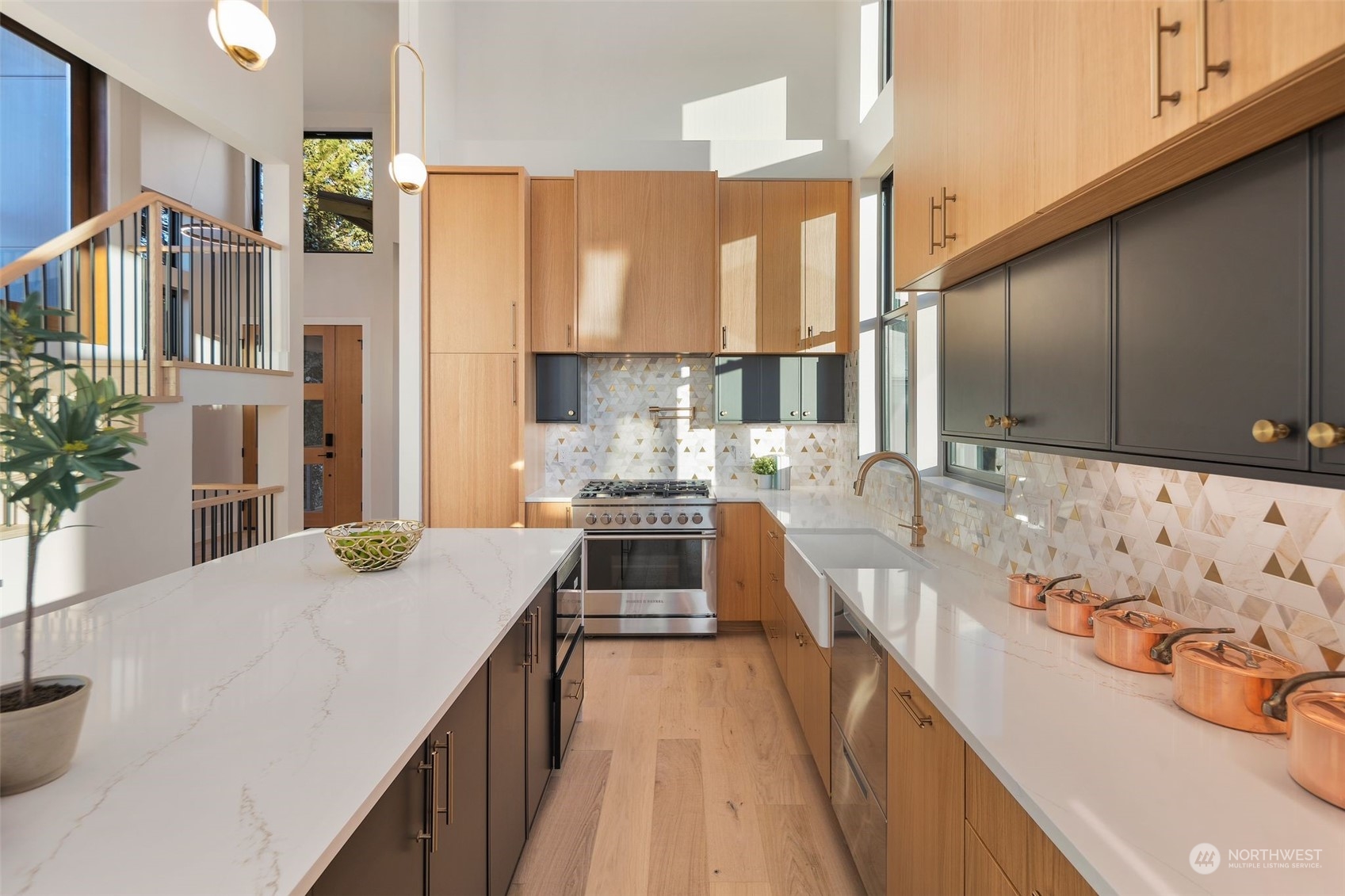 6601 39th Avenue Southwest Seattle, WA 98136 - Photo 5 of 40 a kitchen with stainless steel appliances kitchen island granite countertop a sink stove and cabinets