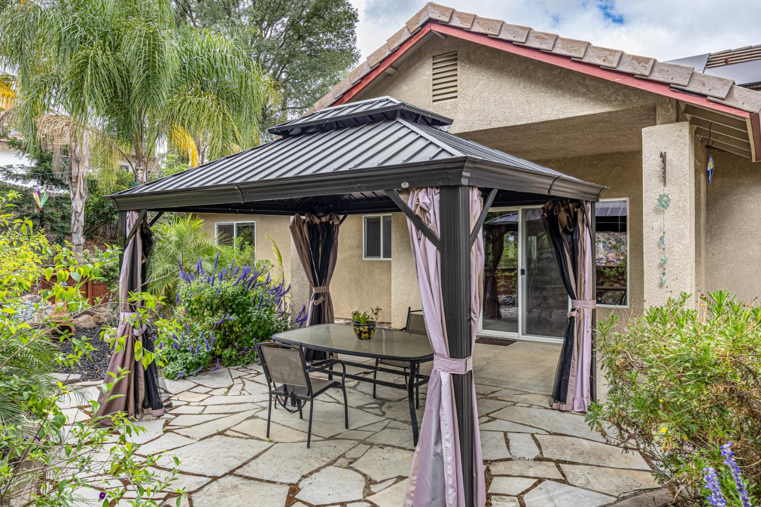 2083 State Rte 26 Valley Springs, CA 95252 - Photo 30 of 59 a front view of a house with garden
