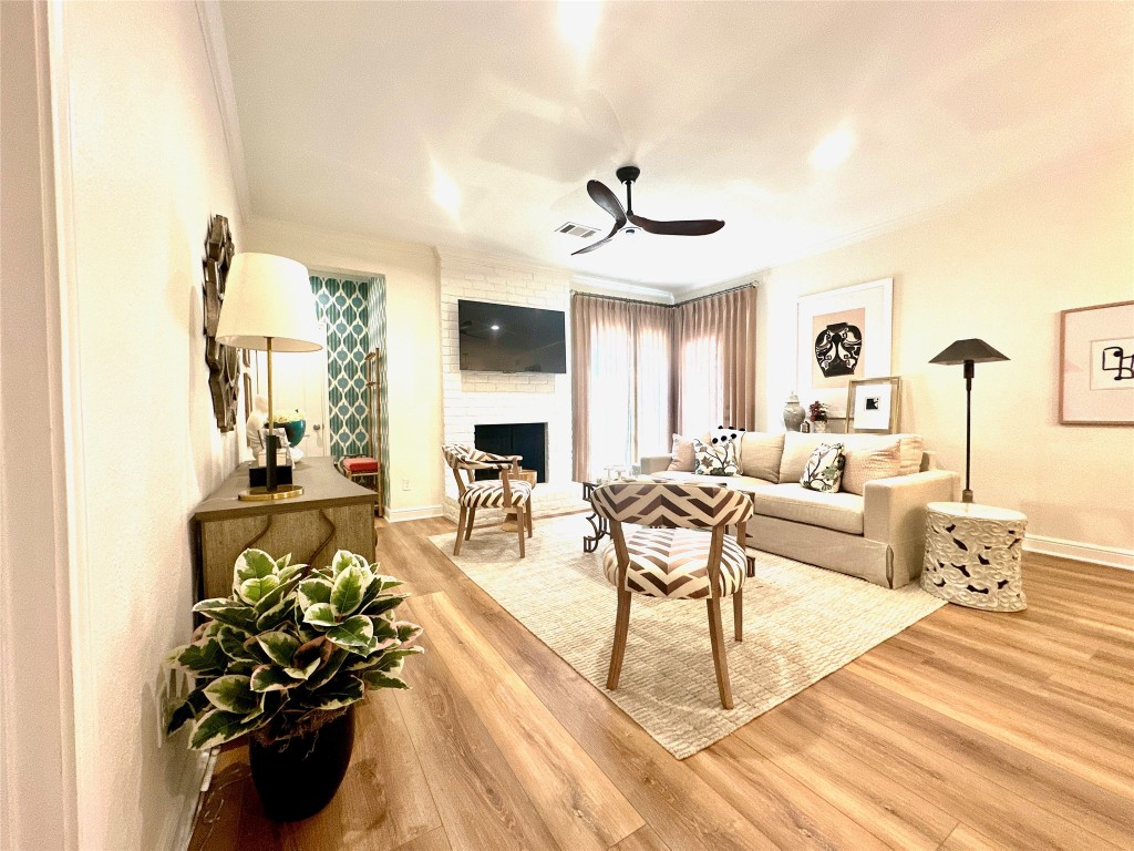 2001 Bering Drive, Unit 7L Houston, TX 77057 - Photo 1 of 33 a living room with furniture flowers and a chandelier