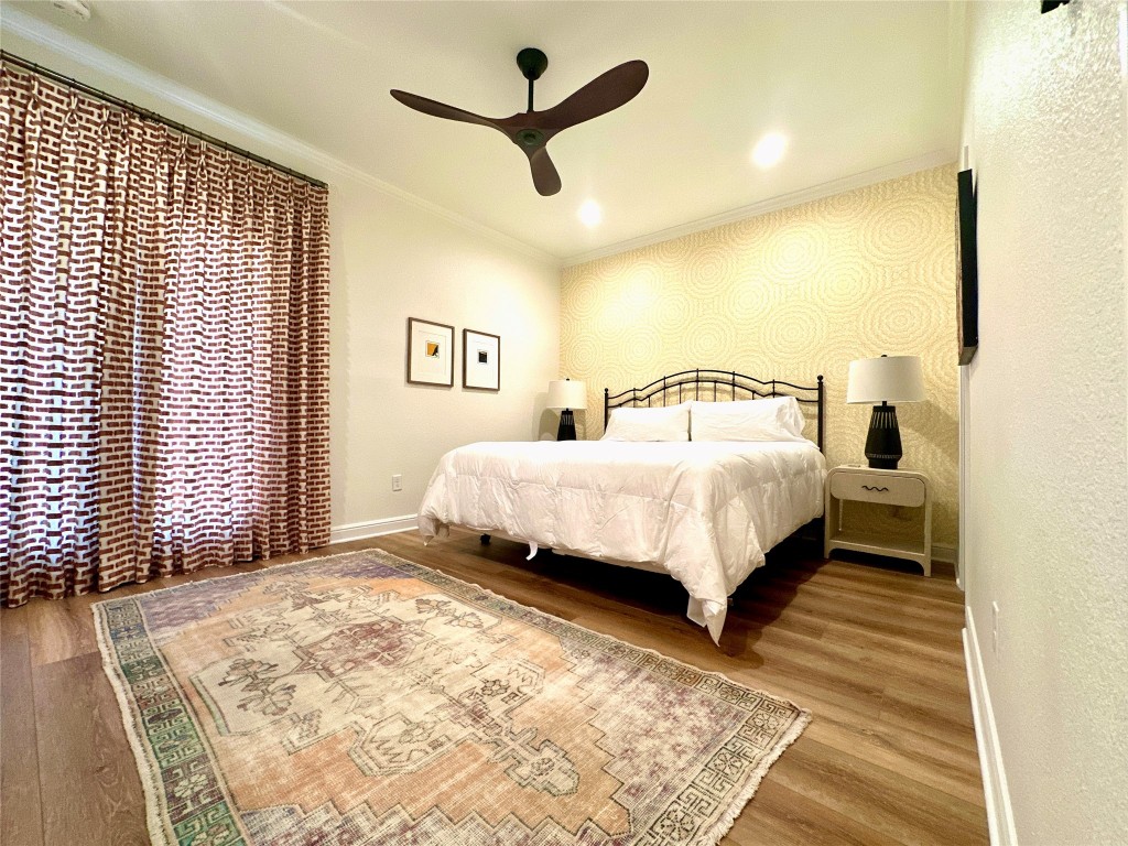 2001 Bering Drive, Unit 7L Houston, TX 77057 - Photo 14 of 33 a bedroom with a bed and a large window