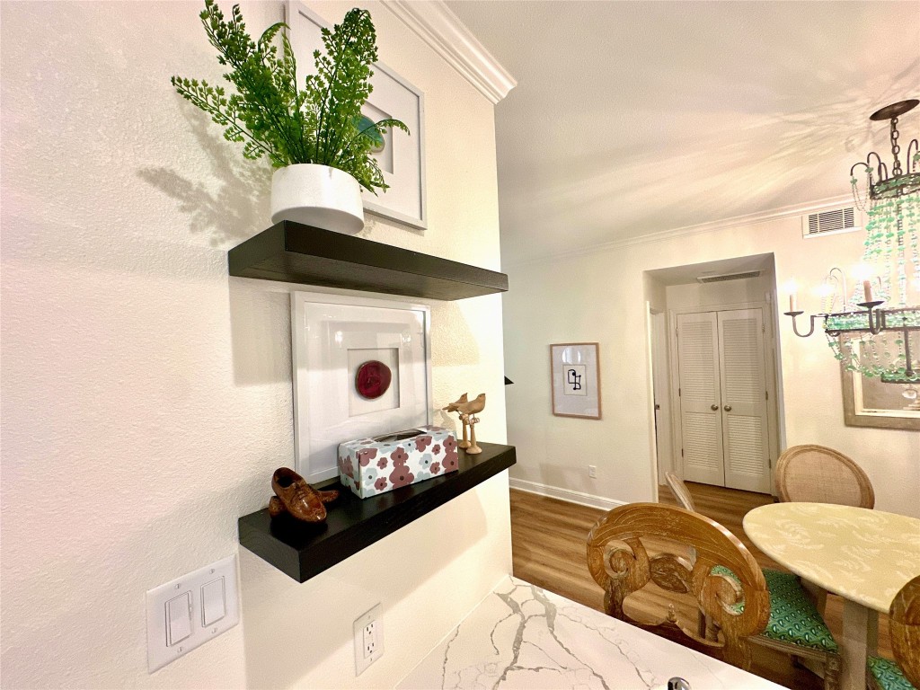 2001 Bering Drive, Unit 7L Houston, TX 77057 - Photo 19 of 33 a bedroom with a bed and a potted plant