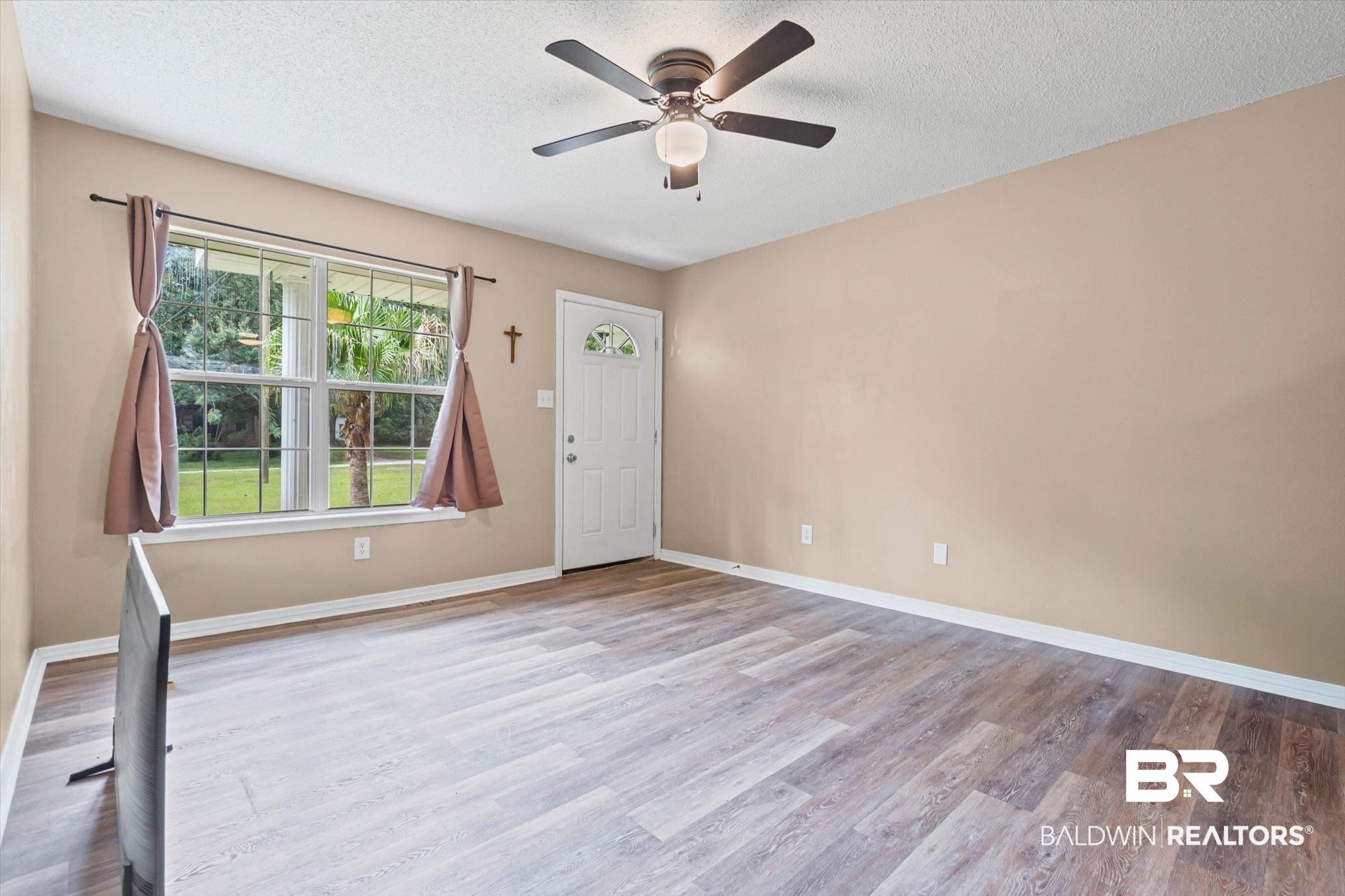 14165 River Oaks Road, Unit A & B Coden, AL 36523 - Photo 3 of 35 Entrance foyer featuring light wood-style flooring, a textured ceiling, and a ceiling fan