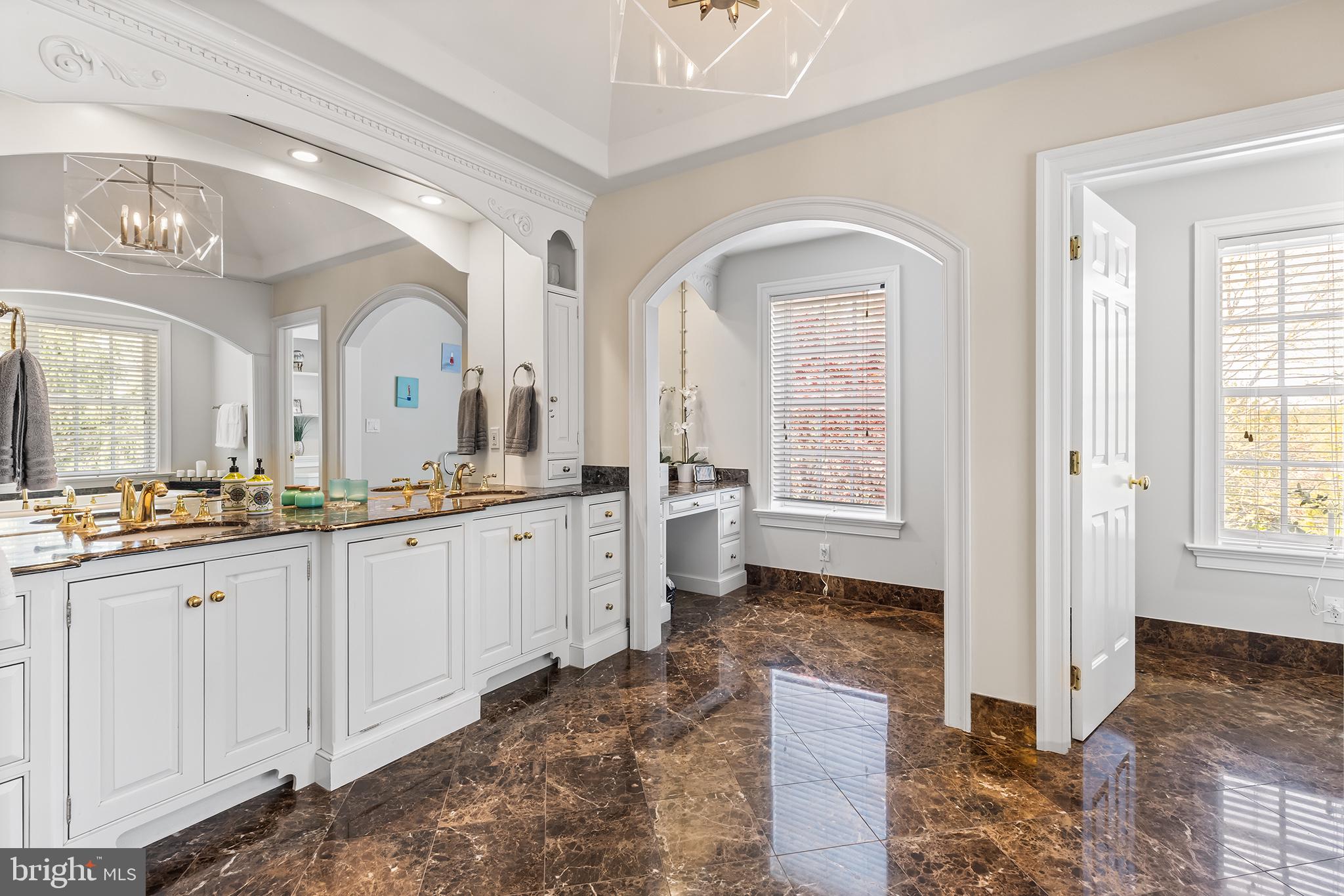 1278 Farm Road Berwyn, PA 19312 - Photo 29 of 65 a spacious bathroom with a granite countertop sink mirror and a bathtub