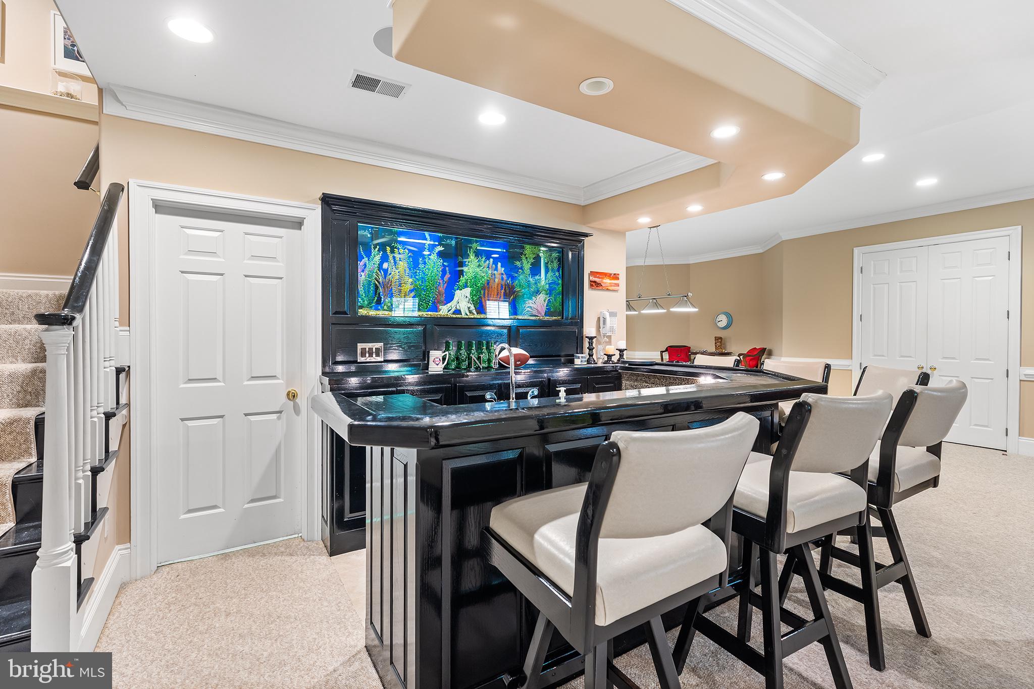1278 Farm Road Berwyn, PA 19312 - Photo 41 of 65 a kitchen with stainless steel appliances kitchen island granite countertop a table and chairs