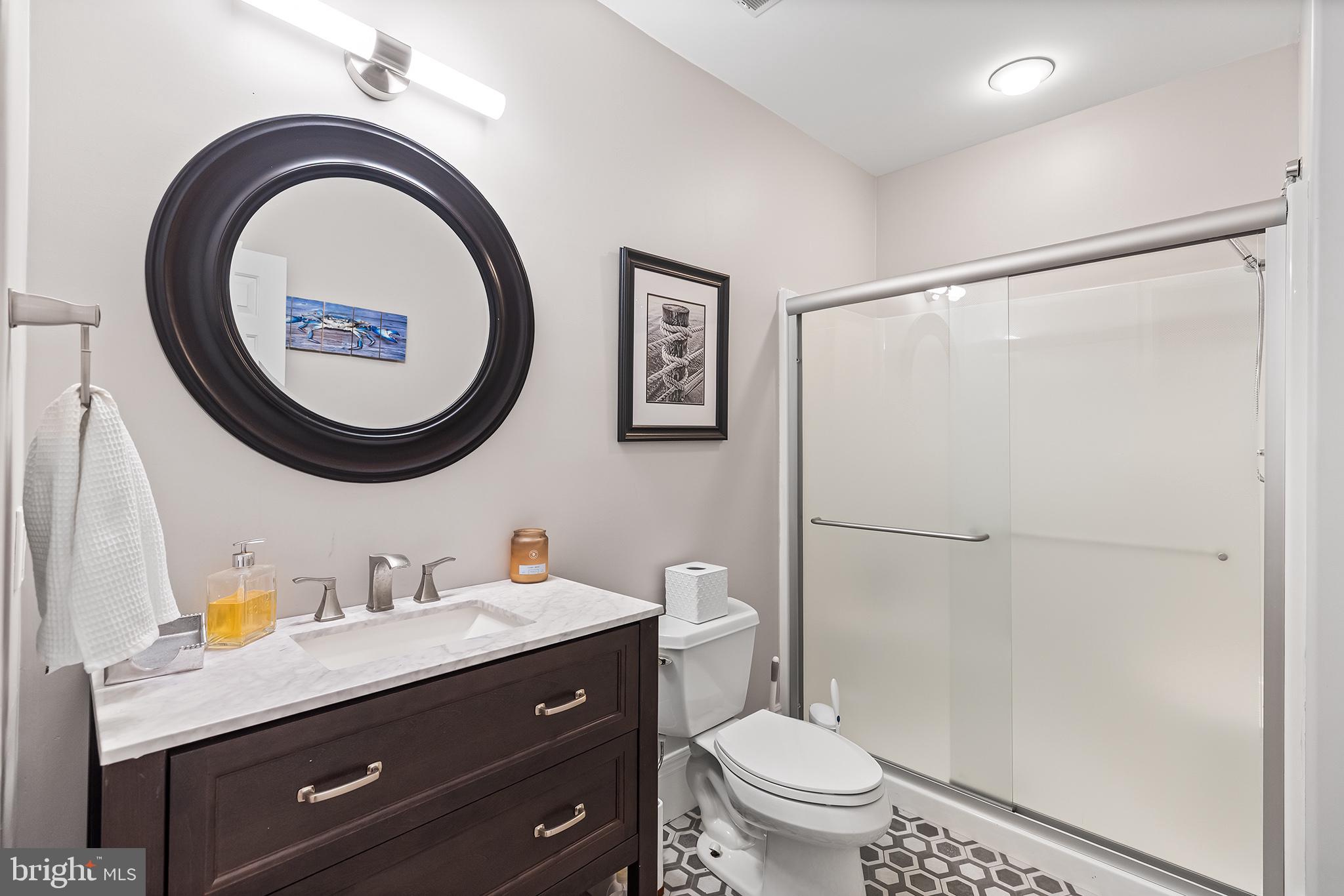 1278 Farm Road Berwyn, PA 19312 - Photo 46 of 65 a bathroom with a toilet a sink and a mirror