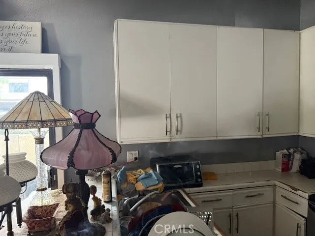 a kitchen with a sink and cabinets