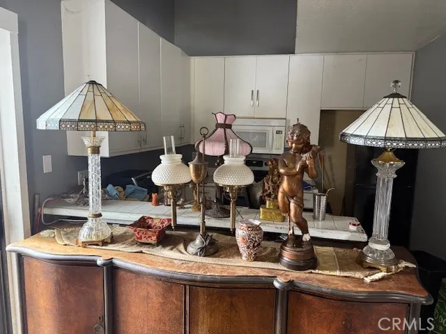 a bedroom with a bed and a potted plant