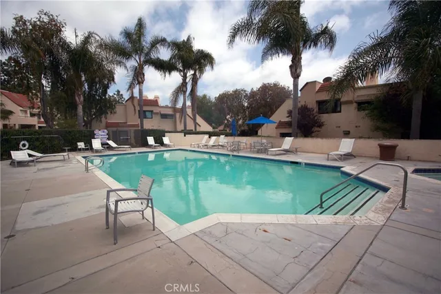 a view of a patio with swimming pool