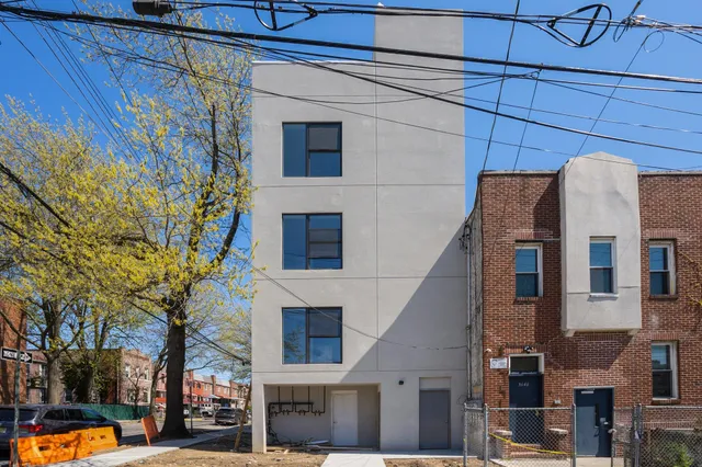 a view of a building with a street
