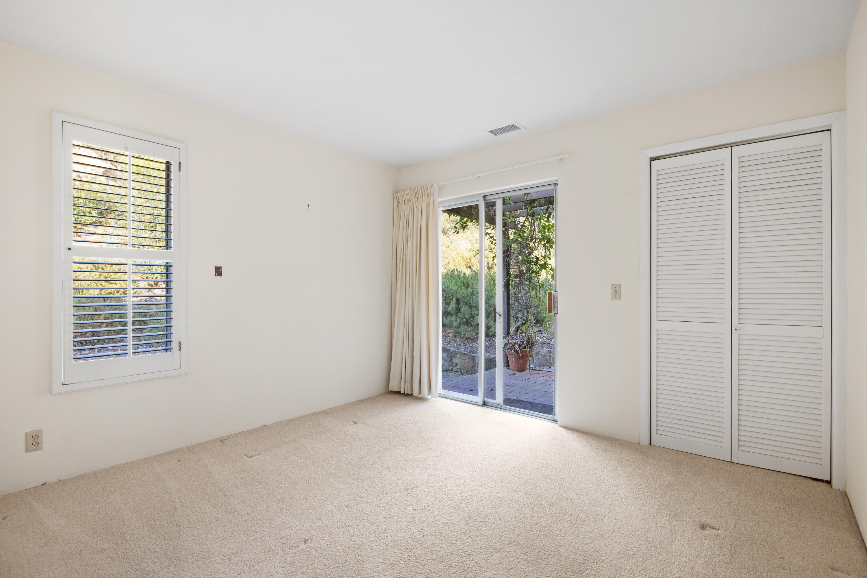1986 Arriba Street Carpinteria, CA 93013 - Photo 15 of 28 a view of an empty room with glass door