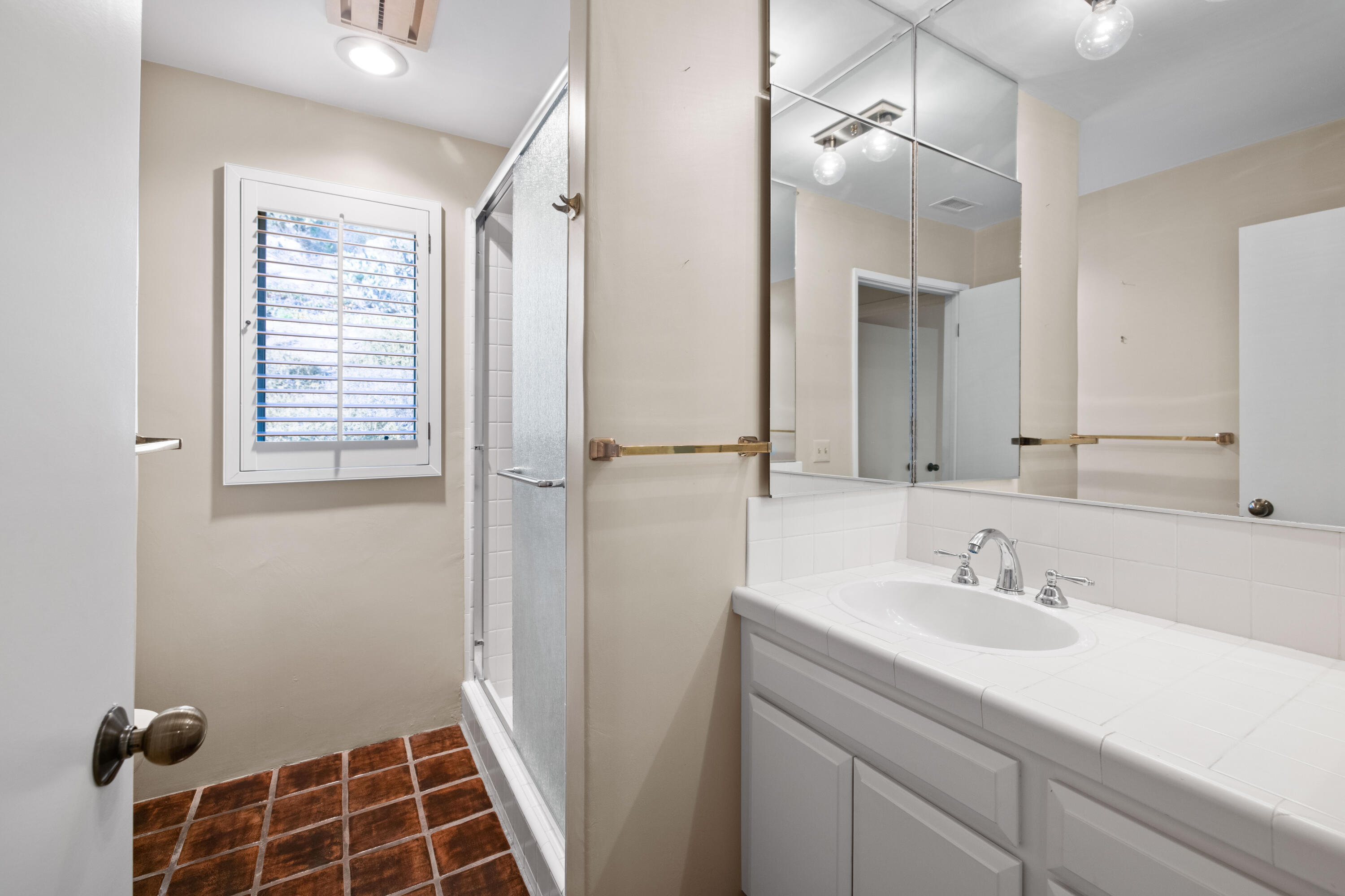 1986 Arriba Street Carpinteria, CA 93013 - Photo 17 of 28 a bathroom with a sink a vanity and a mirror