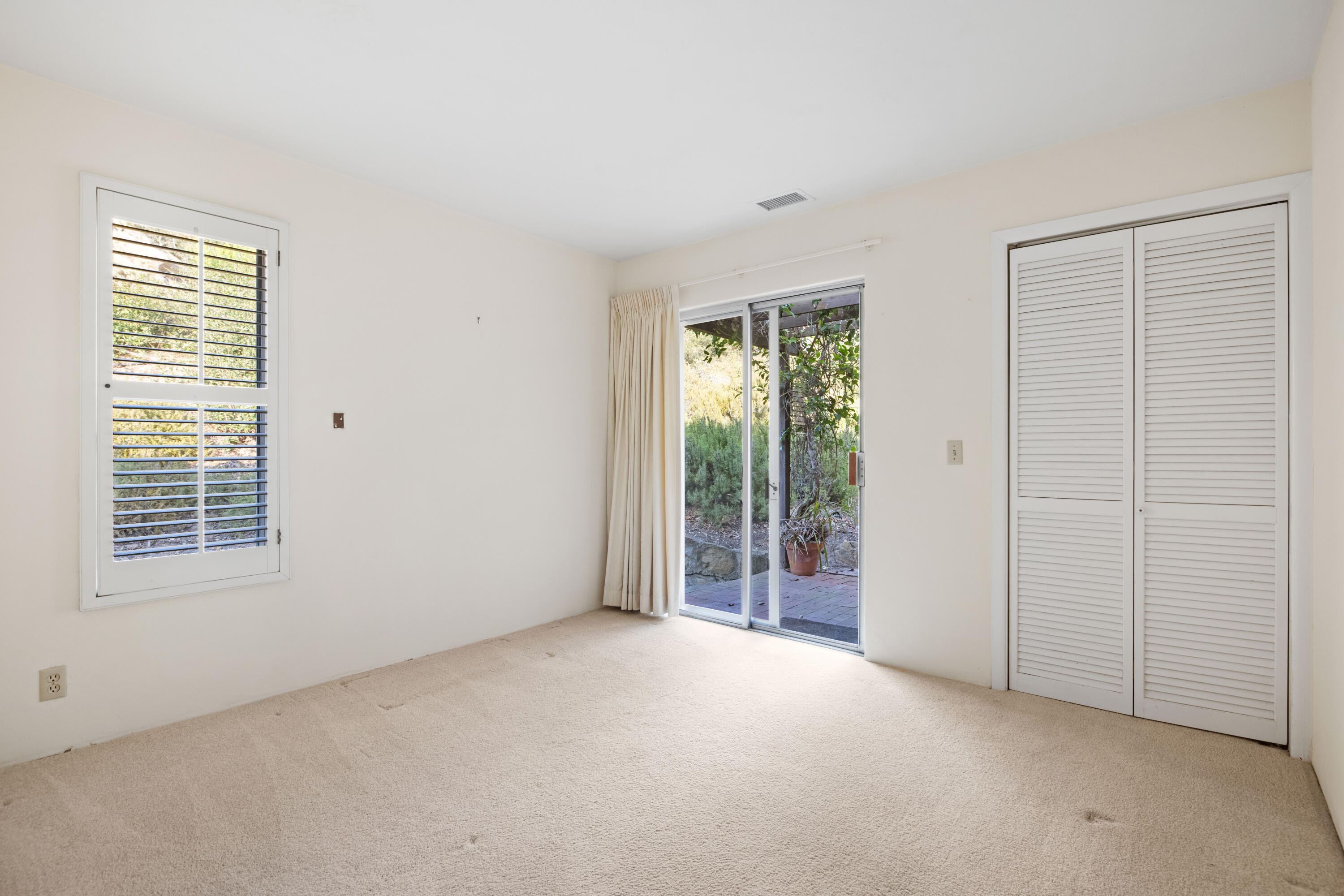 1986 Arriba Street Carpinteria, CA 93013 - Photo 19 of 28 a view of an empty room with glass door