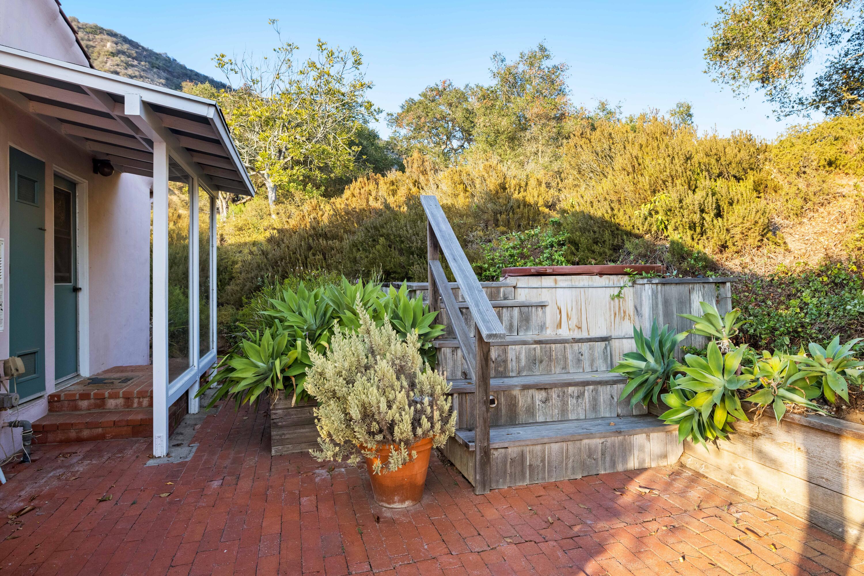 1986 Arriba Street Carpinteria, CA 93013 - Photo 26 of 28 a view of a house with a flower garden