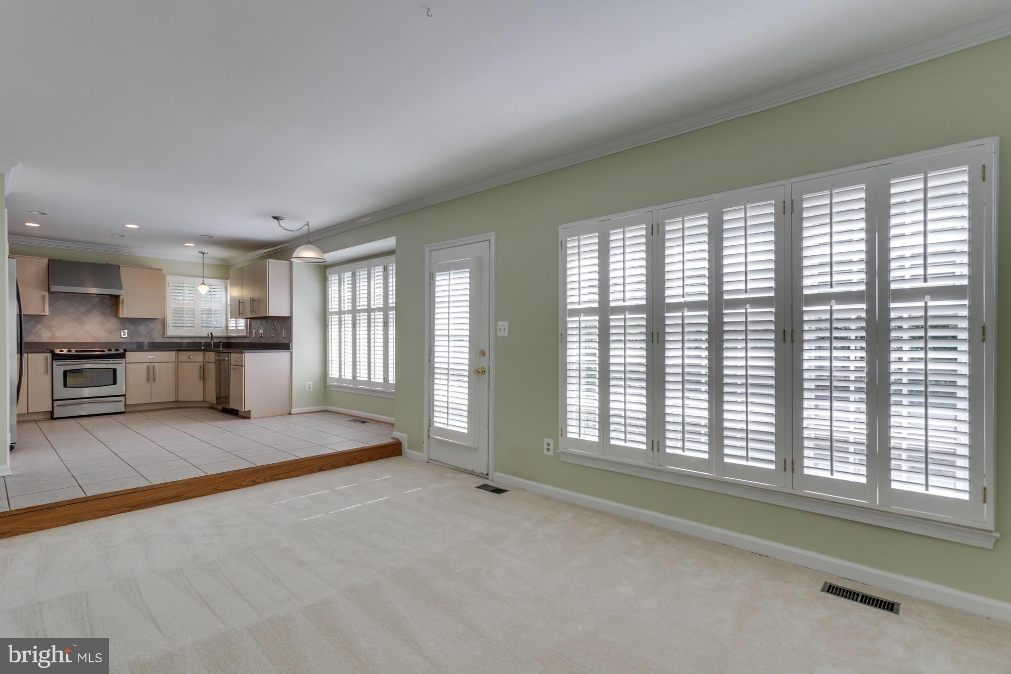 11607 Springhouse Place Reston, VA 20194 - Photo 9 of 28 Family Room to Breakfast Room
