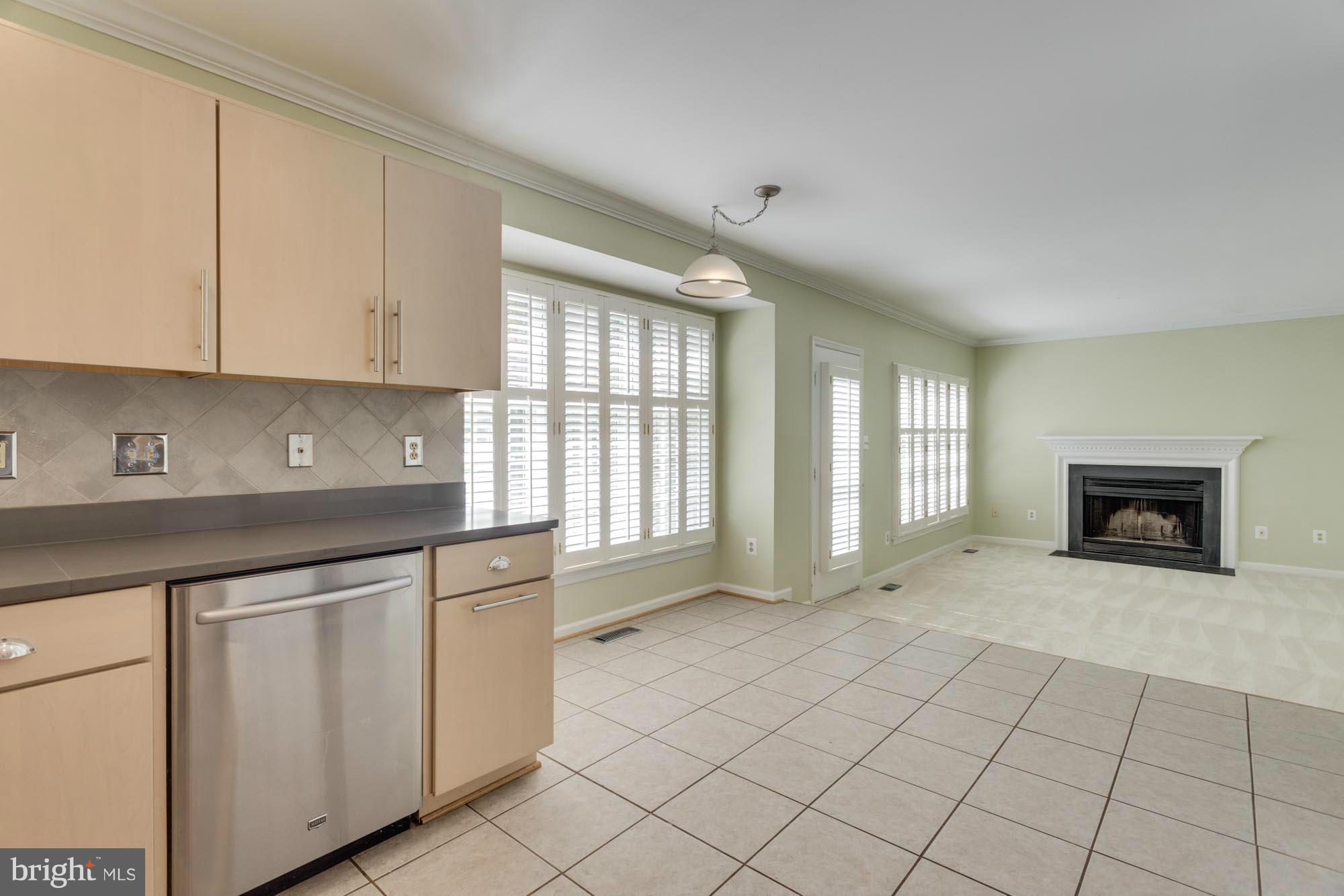 11607 Springhouse Place Reston, VA 20194 - Photo 10 of 28 Kitchen to Family Room