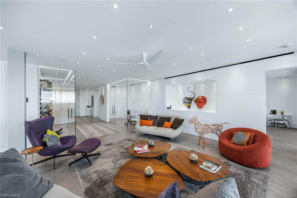 425 Dockside Drive, Unit 905 Naples, FL 34110 - Photo 11 of 50 a living room with furniture and a couch