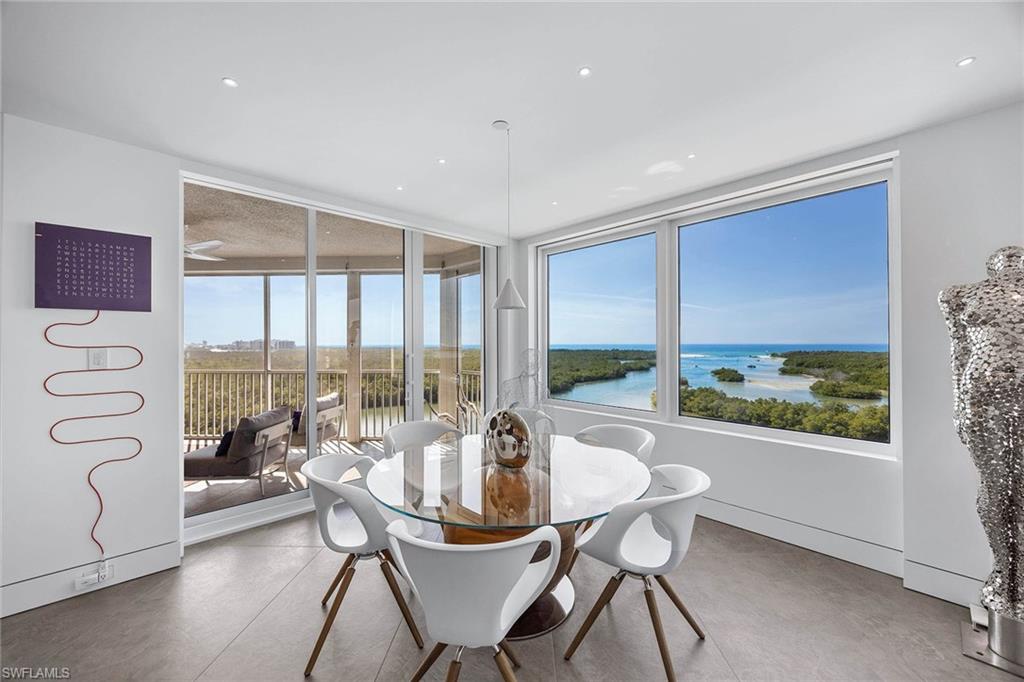 425 Dockside Drive, Unit 905 Naples, FL 34110 - Photo 17 of 50 a view of a dining room with furniture window and outside view